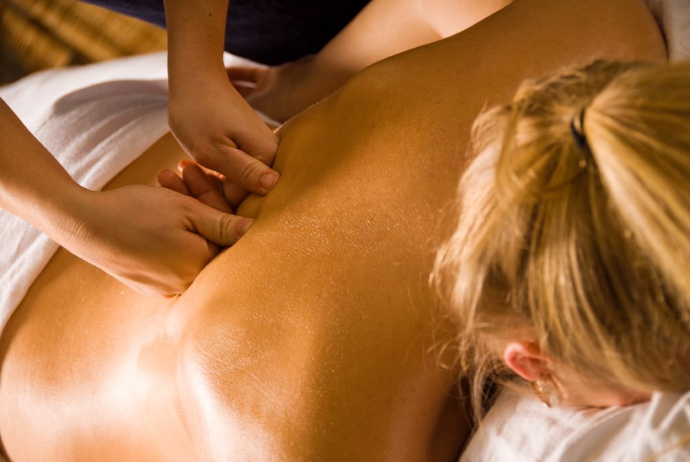 Woman receiving full body massage
