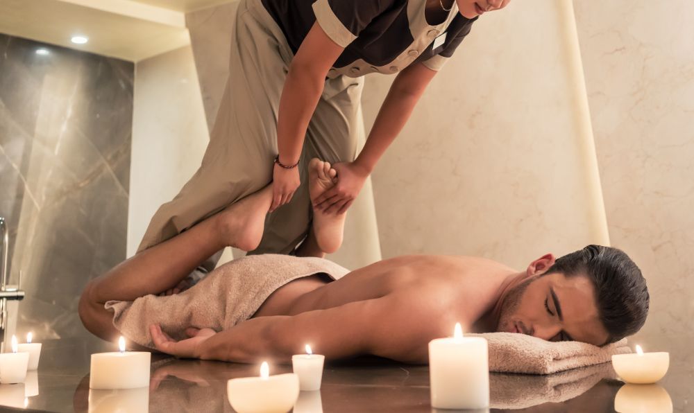 Therapist performing customized massage in 90034 clinic