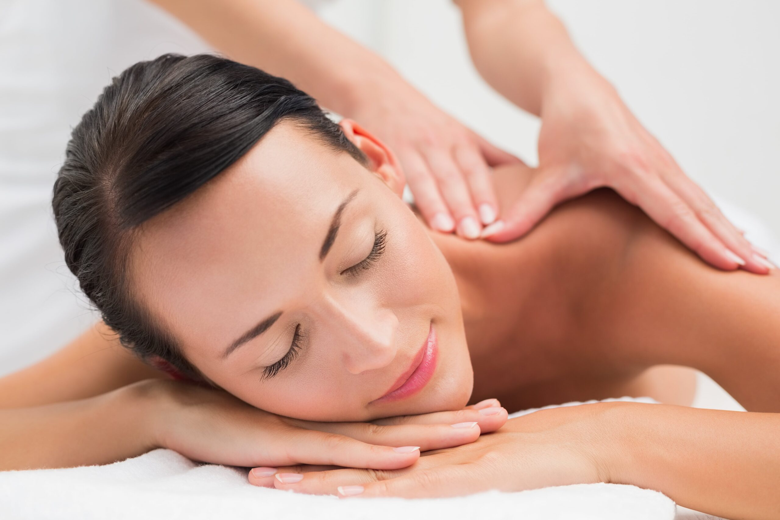 Woman relaxing during professional massage therapy session in Santa Monica