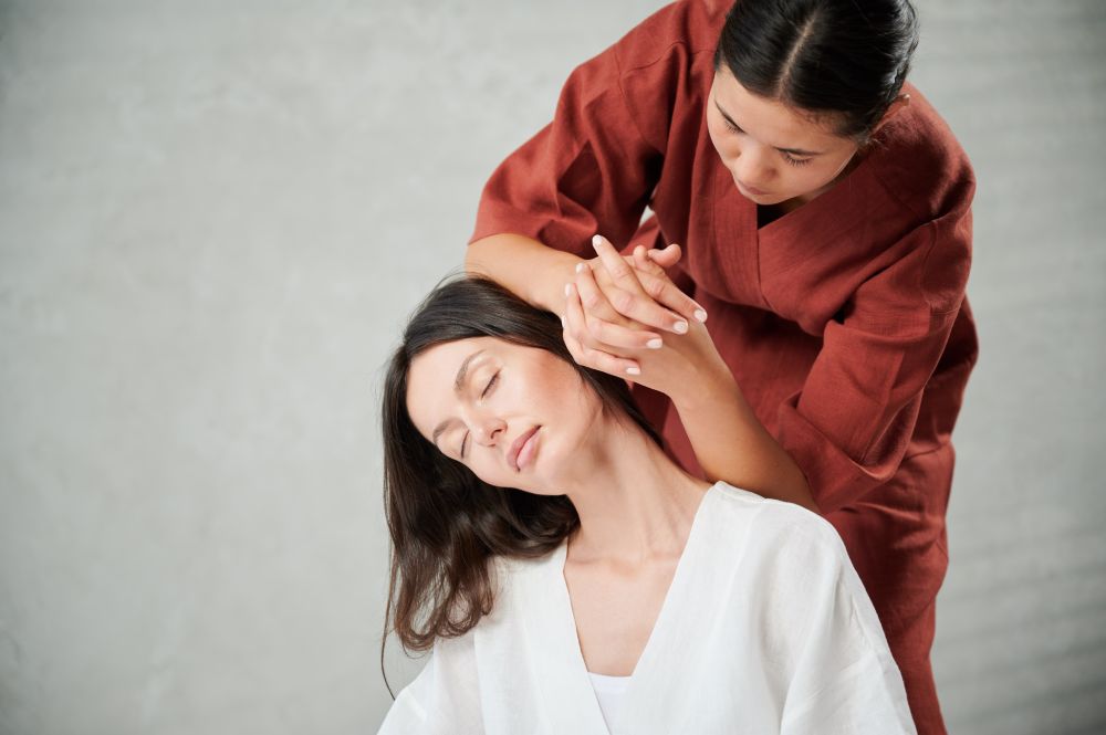 Asian-inspired massage relieving neck and shoulder tension