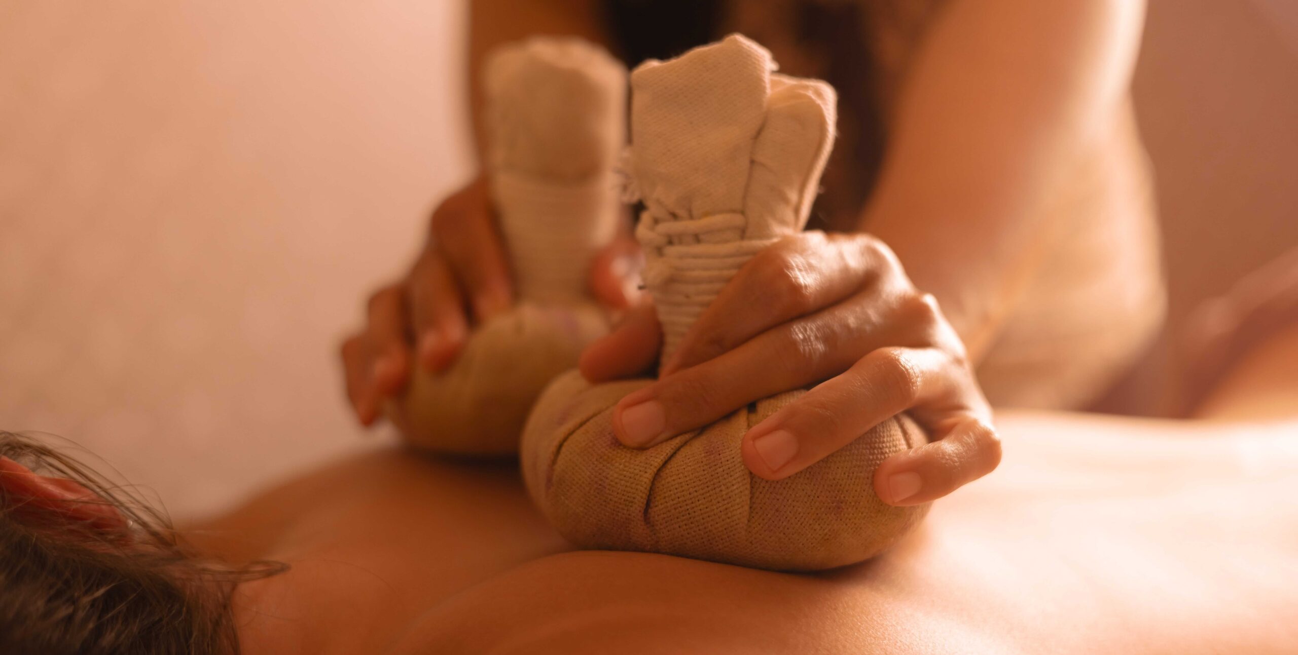 Asian massage in 90034 using warm herbal compress therapy for muscle relaxation